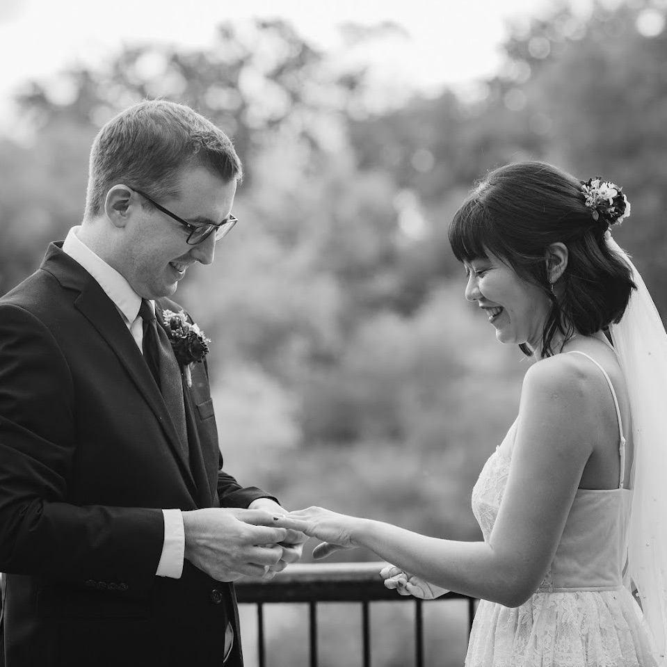 A black-and-white photo of the clients on their wedding day.
